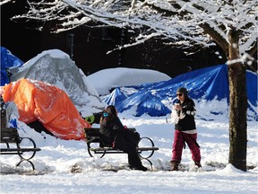 Homeless tenters in Vancouver's Oppenheimer Park have had to also deal with cold and snow.