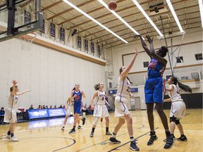 Faith Dut of the Semiahmoo Totems unloads a shot against the Brookswood Bobcats of Langley in last year's triple-A girls provincial basketball championship tournament at Langley Events Centre.