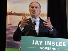 Washington Gov. Jay Inslee takes a turn speaking during a joint news conference with British Columbia Premier John Horgan Thursday, Feb. 7, 2019, in Seattle.