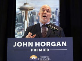 B.C. Premier John Horgan takes a turn speaking during a joint news conference with Washington Gov. Jay Inslee on Thursday.