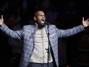 In this Nov. 17, 2015, file photo, musical artist R. Kelly performs the national anthem before an NBA basketball game between the Brooklyn Nets and the Atlanta Hawks in New York.