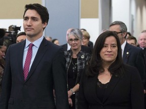 Prime Minister Justin Trudeau and Minister of Justice and Attorney General of Canada Jody Wilson-Raybould take part in the grand entrance as the final report of the Truth and Reconciliation commission is released, Tuesday December 15, 2015 in Ottawa.