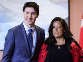 Prime Minister Justin Trudeau and former justice minister Jodie Wilson-Raybould are seen at a swearing-in ceremony in Ottawa on Jan. 14, 2019, as Wilson-Raybold is sworn in as Minister of Veterans Affairs.