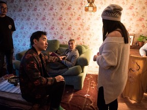 Director/writer Lee Shorten, foreground, first AD Theo Kim, left, Hiro Kanagawa, on couch, and Mayumi Yoshida work on a scene from Shorten's short film Parabola