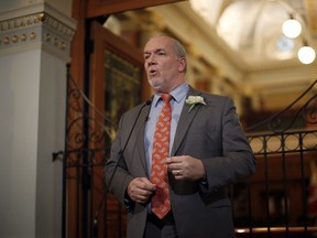 Premier John Horgan answers questions from the media during a press conference following the speech from the throne in the legislative assembly in Victoria, B.C., on Tuesday, February 12, 2019.
