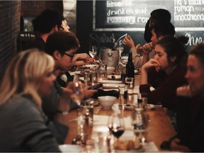 File photo of guests enjoying sips and nibbles at Salt Tasting Room in Vancouver's Blood Alley.