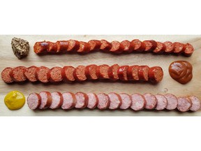 Charcuterie from Oyama Sausage, from top: Debreceni (or Debrecener) sausage with grainy moutarde de Meaux; spicy bison smokie with German curry ketchup; and Polish slaska with Colman’s mustard.