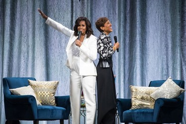 Michelle Obama with Good Morning America anchor Robin Roberts during the former U.S. First Lady's tour stop of Becoming: An Intimate Conversation with Michelle Obama in Vancouver, British Columbia on March 21, 2019.