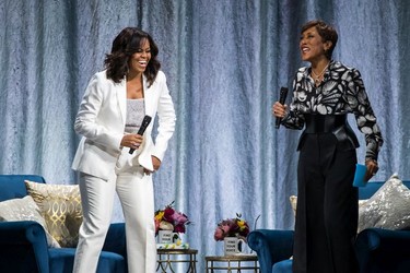 Michelle Obama with Good Morning America anchor Robin Roberts during the former U.S. First Lady's tour stop of Becoming: An Intimate Conversation with Michelle Obama in Vancouver, British Columbia on March 21, 2019.