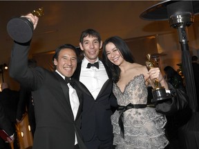 Jimmy Chin, Alex Honnold and Elizabeth Chai Vasarhelyi, winners of the Documentary (feature) Award for Free Solo, celebrate at the 91st annual Academy Awards Governors Ball at Hollywood and Highland on Feb. 24 in Hollywood, Calif.