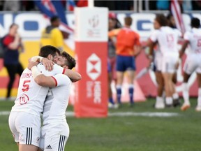 Brett Thompson and Steve Tomasin of the United States hug on the pitch at the end of their cup final victory over Samoa at the USA Sevens Rugby tournament at Sam Boyd Stadium on March 3, 2019 in Las Vegas, Nevada.