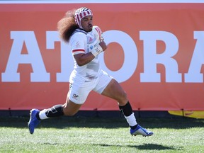 Folau Niua of the United States scores a try against New Zealand during the USA Sevens Rugby tournament at Sam Boyd Stadium in Las Vegas on March 3. The U.S. won 24-19.