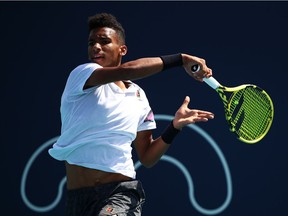 Felix Auger-Aliassime of Canada in action against Casper Ruud of Norway during day four of the Miami Open tennis on March 21, 2019 in Miami Gardens, Florida.