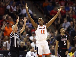 De'Andre Hunter of the Virginia Cavaliers celebrates after a second half play against the Gardner Webb Runnin Bulldogs during the first round of the 2019 NCAA Men's Basketball Tournament at Colonial Life Arena on March 22 in Columbia, S.C.