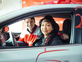 Vancouver hockey player Antoine Roussel was on hand at Basant Motors in Surrey as Karen Moraes was presented with a free 2017 Nissan Sentra on March 8. Moraes was selected as the winner of the dealership's Cars for Compassion contest.