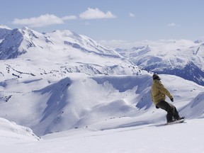 File photo: A rider takes on the terrain while snowboarding at Whistler Blackcomb.