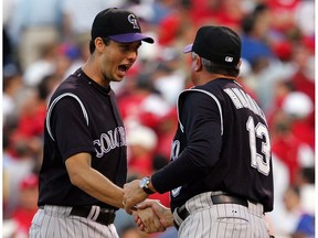 Former Colorado Rockies' pitcher Jeff Francis, congratulated here by ex-manager Clint Hurdle after defeating the Philadelphia Phillies in Game 1 of the National League Divisional Series in 2007, will have his UBC Thunderbirds' jersey retired on Saturday in Vancouver.