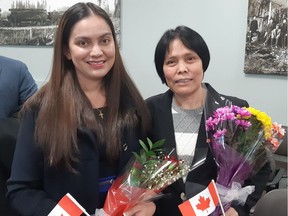 Isabel (left) and Nena Acope became Canadian citizens during a ceremony in Surrey on Monday. Mother and daughter came to Canada four years apart, but swore their oath on the same day.