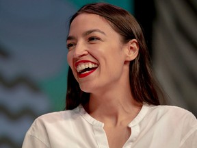 Rep. Alexandria Ocasio-Cortez, D-New York, laughs during South by Southwest on Saturday, March 9, 2019, in Austin, Texas. The festival has grown from obscure roots into a weeklong juggernaut of tech, politics and entertainment.