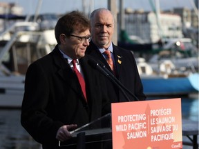 Federal Minister of Fisheries Jonathan Wilkinson (left) and B.C. Premier John Horgan announce the Salmon Restoration and Innovation Fund during a press conference at Fisherman's Wharf in Victoria on Friday, March 15, 2019.