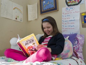 Blythe Timlin, 8, reads Princess in Black.