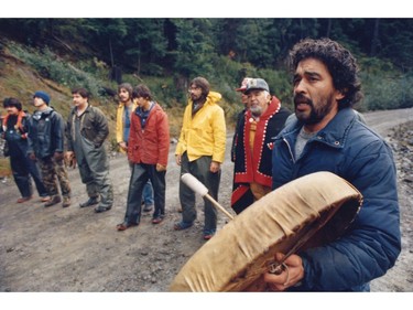 October 31 1985 -Haida protesters at Lyell Island " Indian blockade  ... it stopped loggers Wednesday". Gary Guujaw (formerly Edenshaw) pictured on the far right. Mark van Manen / The Vancouver Sun [PNG Merlin Archive]
