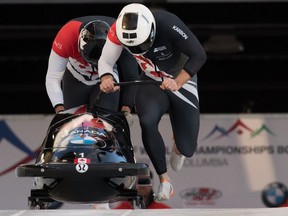Canada's Justin Kripps, front, of Summerland, B.C., and Cameron Stones, of Whitby, Ont., race down the track on their third run during the two-man bobsleigh event at the Bobsleigh World Championships in Whistler, B.C., on Saturday, March 2, 2019.