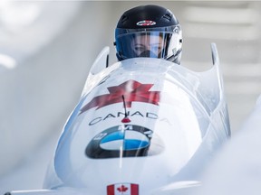 Canada's Kori Hol, of Richmond, B.C., and Melissa Lotholz, of Barrhead, Alta., race down the track on their first run during the women's bobsleigh event at the Bobsleigh World Championships in Whistler on Saturday.