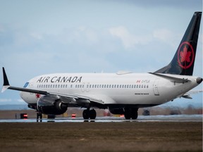 An Air Canada Boeing 737 Max 8 aircraft departing for Calgary taxis to a runway at Vancouver International Airport in Richmond, B.C., on March 12, 2019.