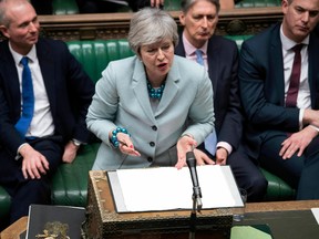In this handout photo provided by the UK Parliament, Britain's Prime Minister Theresa May makes a statement on Brexit to the House of Commons, London, Monday, March 25, 2019.