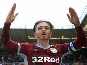 Aston Villa's Jack Grealish celebrates scoring against Birmingham City during their English Championship soccer match at St Andrew's Trillion Trophy Stadium in Birmingham, England, on Sunday March 10, 2019. A Birmingham fan got onto the pitch earlier in the game and punched Grealish in the head.