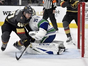 Vancouver Canucks goaltender Jacob Markstrom (25) defends against Vegas Golden Knights center Ryan Carpenter (40) during the second period of an NHL hockey game Sunday, March 3, 2019, in Las Vegas.