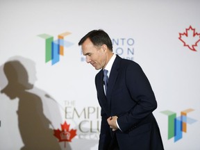 Canadian finance minister Bill Morneau leaves the stage following an armchair discussion hosted by the Toronto Region Board of Trade, The Empire Club and Canadian Club of Toronto, in Toronto, Wednesday, March 20, 2019.