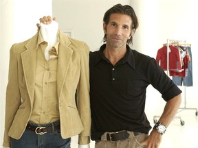 FILE – This May 15, 2002 file photo shows Los-Angeles based clothing designer Mossimo Giannulli posing with his fall preview clothing for Target department stores in New York.