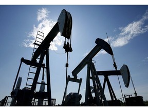 Pumpjacks are shown pumping crude oil near Halkirk, Alta.