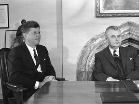 In this May 17, 1961 file photo, U.S. President John Kennedy and Prime Minister John Diefenbaker meet to begin talks on U.S. and Canadian problems in Ottawa, Canada. The prime minister's bureaucrats are hoarding a trove of decades-old records that chronicle Canada's Cold War intelligence history, say security researchers who are pushing to make the files publicly accessible. THE CANADIAN PRESS/AP Photo