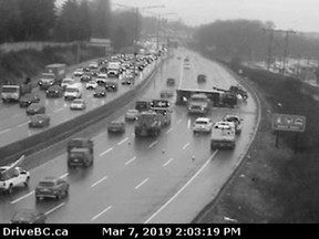 Webcam footage shows crews cleaning up an accident involving a semi truck on Highway 1 in Burnaby,