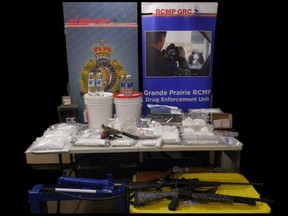 A B.C. man is facing multiple charges after a search warrant leads to Grande Prairie RCMP seizing over $600,000 worth of drugs, currency and guns. Supplied