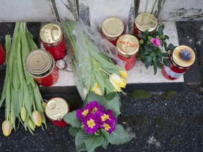 Flowers are set at a house of a doctor, who died in an explosion by a booby trap in Enkenbach-Alsenborn, Germany, Tuesday, March 5, 2019. A gardener, who was found also dead, is suspected to have set the booby trap.