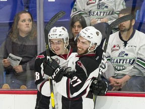 Vancouver Giants #27 Seth Bafard and #28 Lukas Svejkovsky celebrate Svejkovsky's goal on the Seattle Thunderbirds in the second period of Game 1 of the WHL playoffs at the Langley Events Centre on Friday night.