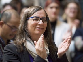 Morgane Oger applauds during an announcement at the Vancouver General Hospital in Vancouver, B.C. Friday, Nov. 16, 2018. An advocacy organization says it wants to map hatred and discrimination across Canada in a move that is prompting warnings of caution from one civil liberties group.
