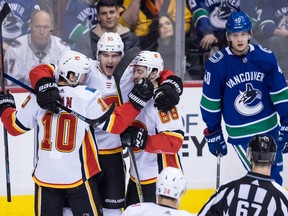 Rookie Elias Pettersson, right, has been a welcome addition to the Vancouver Canucks, but he's had to watch a lot of goal and victory celebrations by his opponents.