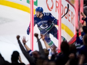 Vancouver Canucks' Tyler Motte celebrates his first goal against the New York Rangers during the second period of an NHL hockey game in Vancouver, on Wednesday March 13, 2019.