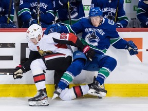 Ottawa Senators' Magnus Paajarvi, left, and Canucks' Jake Virtanen collide during the second period.