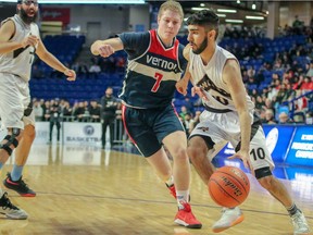 Vikramjit Hayer of the North Delta Huskies tries to dribble past the defence of Vernon Panthers’ Carson Dohnal in the triple-A final Saturday at Langley Events Centre.