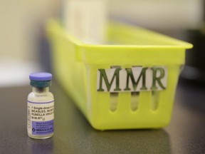 A measles vaccine is shown on a countertop.