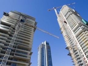 Condo towers under construction on Beresford Avenue in the Metrotown area of Burnaby on March 19. While the federal budget's assistance to first-time homebuyers is welcome, its upper limit still doesn't buy very much in the region's pricey property markets.
