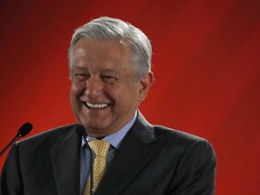 In this Friday, March 8, 2019 photo, Mexican President Andres Manuel Lopez Obrador talks to journalists at his daily 7 a.m. press conference at the National Palace in Mexico City. Lopez Obrador's first 100 days in office have combined a compulsive shedding of presidential trappings with a dizzying array of policy initiatives, and a series of missteps haven't even dented his soaring approval ratings.