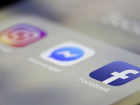 Facebook, Messenger and Instagram apps are are displayed on an iPhone on Wednesday, March 13, 2019, in New York. Facebook says it is aware of outages on its platforms including Facebook, Messenger and Instagram and is working to resolve the issue.