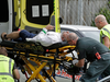 Ambulance staff remove a man from outside a mosque in Christchurch, New Zealand, March 15, 2019.